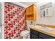 Bathroom with vanity, toilet, and shower with patterned curtain at 12655 E Pacific Cir # E, Aurora, CO 80014