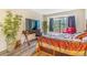 Cozy bedroom with a large window, a TV, and ample space for relaxation at 12655 E Pacific Cir # E, Aurora, CO 80014