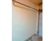Garage interior with a light yellow wall, a metal track and part of a garage door on the side at 12655 E Pacific Cir # E, Aurora, CO 80014