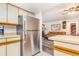 Well-maintained kitchen with stainless steel appliances and view into the living room at 12655 E Pacific Cir # E, Aurora, CO 80014