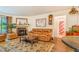 Comfortable living room featuring a fireplace, leather sofa, and stylish decor at 12655 E Pacific Cir # E, Aurora, CO 80014