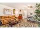 Inviting living room with a comfortable leather sofa and stylish decor at 12655 E Pacific Cir # E, Aurora, CO 80014