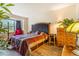 Cozy main bedroom with a large bed, dresser, and natural lighting at 12655 E Pacific Cir # E, Aurora, CO 80014