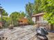 Outdoor deck with rustic wooden features, grill, and outdoor seating area at 1076 S Leyden St, Denver, CO 80224