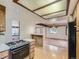 Kitchen with tile backsplash and a breakfast bar at 1076 S Leyden St, Denver, CO 80224