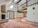Living room with a fireplace and large window at 1076 S Leyden St, Denver, CO 80224