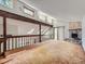 Loft with a fireplace and railing overlooking the first floor at 1076 S Leyden St, Denver, CO 80224