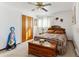 Bright bedroom with a queen bed and wood chest at 6445 Iris St, Arvada, CO 80004