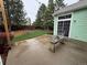 A lovely backyard and patio enhance this home's appeal with a green lawn, mature trees, and a charming outdoor bench at 9806 Hooker Ct, Denver, CO 80031