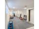 Large, unfinished basement with plenty of storage space and exercise equipment at 9806 Hooker Ct, Denver, CO 80031