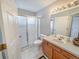 Bathroom featuring a shower with a glass door, toilet, and vanity at 9806 Hooker Ct, Denver, CO 80031