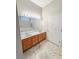 Double vanity sink with a large mirror and decorative lighting in a bathroom at 9806 Hooker Ct, Denver, CO 80031