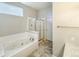 Clean bathroom with a soaking tub and a separate shower at 9806 Hooker Ct, Denver, CO 80031