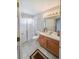 Bathroom featuring a vanity with sink, toilet and a glass-enclosed shower at 9806 Hooker Ct, Denver, CO 80031