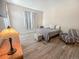 Well-lit bedroom with wood floors and a large window at 9806 Hooker Ct, Denver, CO 80031