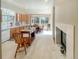 Bright and airy kitchen with light wood cabinets, large windows and tile floors at 9806 Hooker Ct, Denver, CO 80031