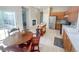Open kitchen with wood cabinets, stainless steel appliances and a fireplace at 9806 Hooker Ct, Denver, CO 80031