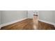 A spacious area featuring beautiful hardwood floors and access to the kitchen area at 3254 Newton St, Denver, CO 80211