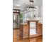 Updated kitchen featuring stainless steel appliances, white cabinets, butcher block island, and modern lighting at 3254 Newton St, Denver, CO 80211