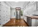 Spacious kitchen featuring custom cabinetry, butcher block countertops, stainless steel appliances, and hardwood floors at 3254 Newton St, Denver, CO 80211