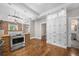 Spacious kitchen with stainless steel oven, island with seating, and large cabinets for ample storage at 3254 Newton St, Denver, CO 80211