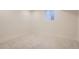 Clean, empty basement space with a small window at 4350 S Delaware St, Englewood, CO 80110