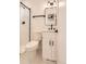 Bright bathroom featuring a modern vanity, sleek fixtures, and a shower with white subway tile at 4350 S Delaware St, Englewood, CO 80110