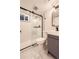 Modern bathroom featuring glass enclosed shower, sleek fixtures, and a stylish vanity at 4350 S Delaware St, Englewood, CO 80110