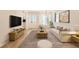 Spacious living room featuring hardwood floors, comfortable seating, and ample natural light at 4350 S Delaware St, Englewood, CO 80110