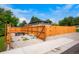 Fenced in RV parking area and secure backyard gate at 6163 W 76Th Ave, Arvada, CO 80003