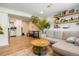 Open living room design including modern furniture, and a large kitchen area at 6163 W 76Th Ave, Arvada, CO 80003