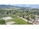 Panoramic aerial view of a residential neighborhood with a lake and mountains at 10152 Telluride St, Littleton, CO 80125