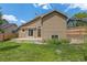 Exterior backyard features a large lawn and a concrete patio at 10152 Telluride St, Littleton, CO 80125