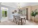 Bright dining area features a modern chandelier and patio door to the outdoor view at 10152 Telluride St, Littleton, CO 80125