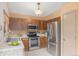 Functional kitchen with stainless steel appliances and classic cabinetry at 10152 Telluride St, Littleton, CO 80125