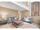 Spacious living room with high ceilings and a leather ottoman at 10152 Telluride St, Littleton, CO 80125