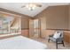 Bedroom has plush carpet, a window with blinds, and neutral tones throughout at 10152 Telluride St, Littleton, CO 80125