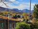 Scenic view of the neighborhood with fall colors, trees, and mountains in the background at 10152 Telluride St, Littleton, CO 80125