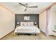 Well-lit bedroom showcasing a ceiling fan, complementing lamps, and contemporary design at 2253 Augusta Dr, Evergreen, CO 80439