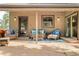 Covered patio featuring cozy seating, ample lighting, and a welcoming atmosphere for relaxation at 2253 Augusta Dr, Evergreen, CO 80439