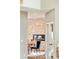 View of the dining area with stone accent wall and modern fireplace at 2253 Augusta Dr, Evergreen, CO 80439