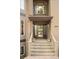 Close-up of the front door with sidelights and decorative plants on the front steps at 2253 Augusta Dr, Evergreen, CO 80439