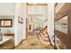 Grand foyer with high ceilings, tile flooring, staircase, and views into living spaces at 2253 Augusta Dr, Evergreen, CO 80439