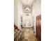 Spacious entryway with high ceilings, chandelier, and tile flooring that leads to various rooms at 2253 Augusta Dr, Evergreen, CO 80439
