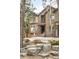Inviting two-story home featuring a rock garden, covered entryway, and outdoor seating at 2253 Augusta Dr, Evergreen, CO 80439