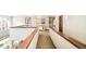 Upper hallway featuring carpet, white walls with wood trim, and views to below at 2253 Augusta Dr, Evergreen, CO 80439