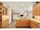 Well-lit kitchen with granite countertops, custom cabinets, and modern appliances at 2253 Augusta Dr, Evergreen, CO 80439