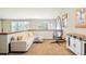Comfortable loft living room with a cozy sofa, hanging chair and ample natural light at 2253 Augusta Dr, Evergreen, CO 80439