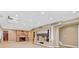 Finished basement with carpet, wet bar, shelving alcove, and recessed lighting at 570 Stonemont Dr, Castle Pines, CO 80108