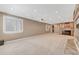 Finished basement with carpet, recessed lights, wet bar, projector and a shuttered window at 570 Stonemont Dr, Castle Pines, CO 80108